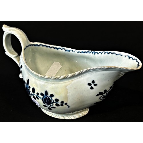 108 - An 18th century Liverpool porcelain sauce boat painted with trailing flowers, 18cm long