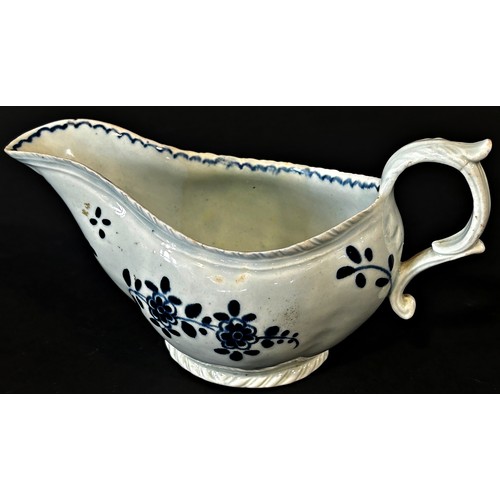 108 - An 18th century Liverpool porcelain sauce boat painted with trailing flowers, 18cm long