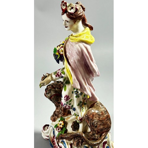 116 - An 18th century Bow porcelain figure of the Roman God Ceres, a lion at her feet, she holding a cornu... 