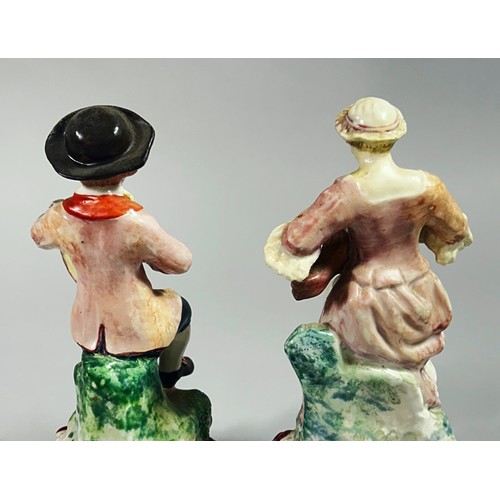 119 - A pair of 18th century Plymouth porcelain figures, male and female musicians, he playing a pipe and ... 