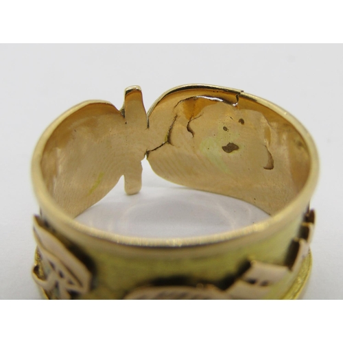 298 - Yellow metal band ring with applied Egyptian hieroglyphic decoration, size M, 3g (af)