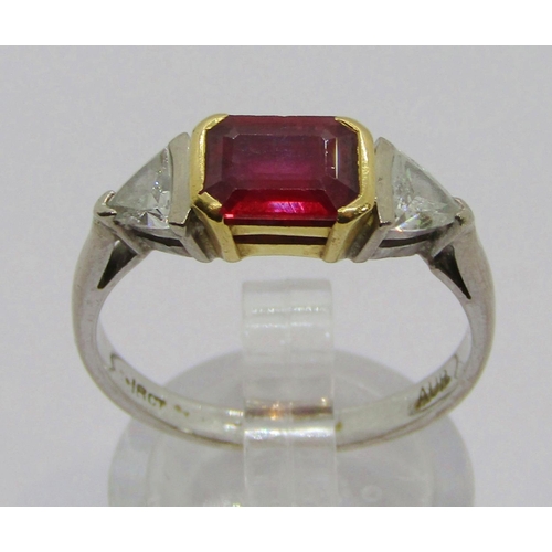 299 - 18ct bi-colour emerald-cut ruby and trillion-cut diamond three stone ring, ruby 7 x 5.5mm approx, di... 