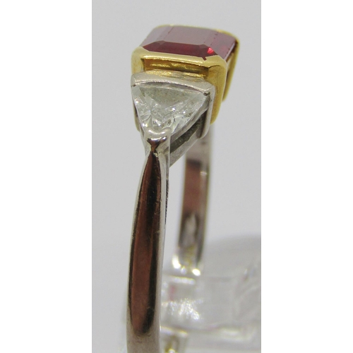 299 - 18ct bi-colour emerald-cut ruby and trillion-cut diamond three stone ring, ruby 7 x 5.5mm approx, di... 