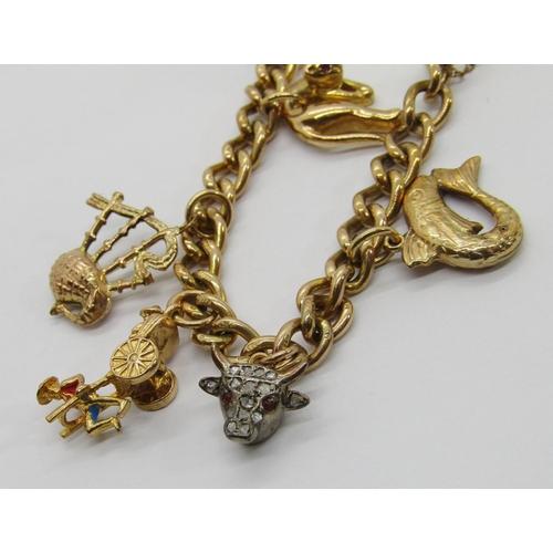 301 - Vintage 9ct charm bracelet with heart padlock clasp, hung with ten novelty charms to include a bull ... 