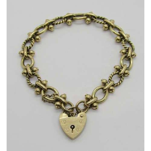 303 - 9ct fancy link bracelet with heart padlock clasp, maker 'ASJ', London 1994, 30.7g