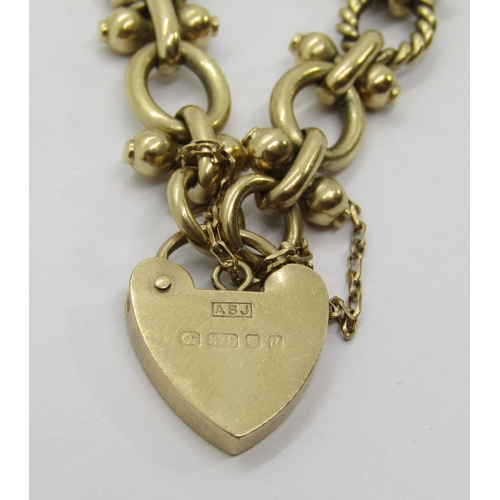 303 - 9ct fancy link bracelet with heart padlock clasp, maker 'ASJ', London 1994, 30.7g