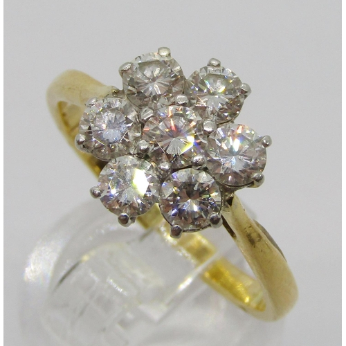 304 - Vintage yellow metal brilliant-cut diamond daisy cluster ring with white metal setting, set with sev... 