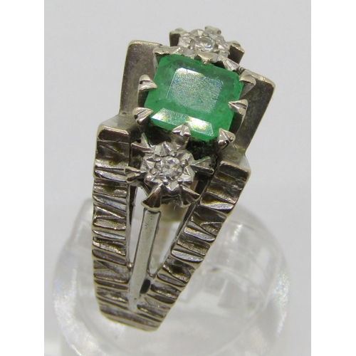 308 - Vintage 18ct white gold emerald and diamond three stone ring with raised setting, the emerald 11 x 1... 