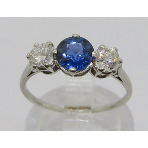 315 - White metal sapphire and diamond three stone ring, sapphire 0.75ct approx, diamonds 0.20ct each appr... 