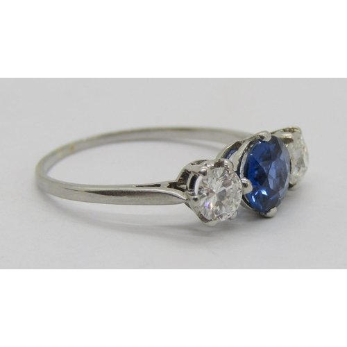 315 - White metal sapphire and diamond three stone ring, sapphire 0.75ct approx, diamonds 0.20ct each appr... 