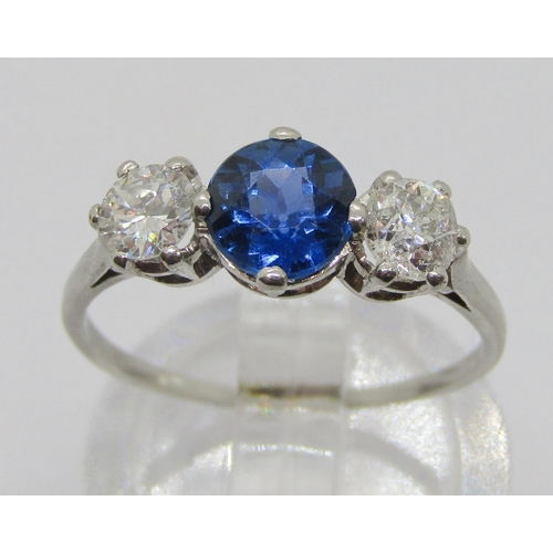 315 - White metal sapphire and diamond three stone ring, sapphire 0.75ct approx, diamonds 0.20ct each appr... 