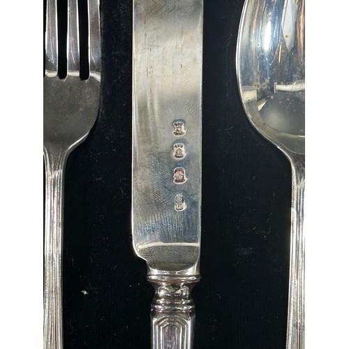 242 - A cased silver christening knife, fork and spoon set, London 1929, maker Josiah Williams 2.6 ozs all... 