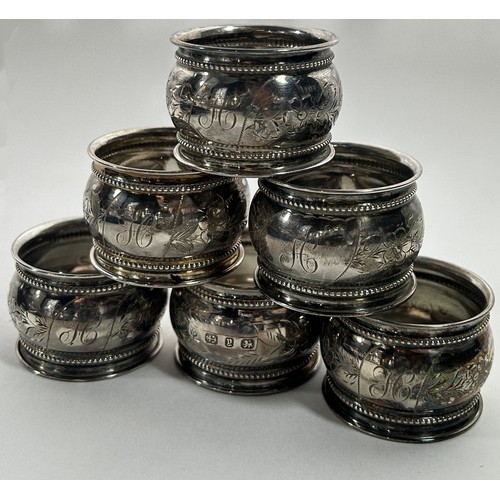 245 - A cased set of six late Victorian napkin rings, floral engraved decoration with the inital 'H', Birm... 