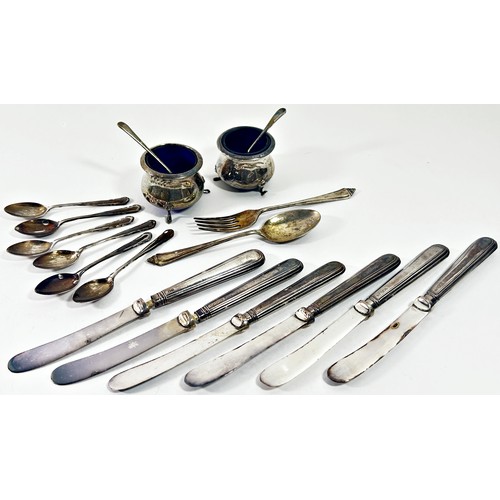 249 - A cased silver condiment set, a cased set of six teaspoons, a christening spoon and fork, six silver... 