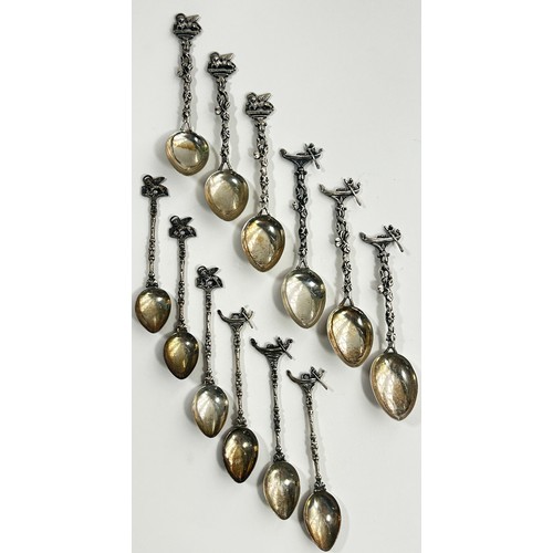 254 - Italian silver stamped 800, six teaspoons, six coffee spoons and a fruit knife, all with Venetian sy... 