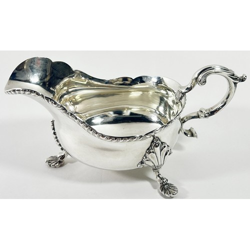 259 - A Georgian style silver gravy boat, Birmingham 1938, maker Barker Brothers Silver Ltd, 10 ozs approx... 