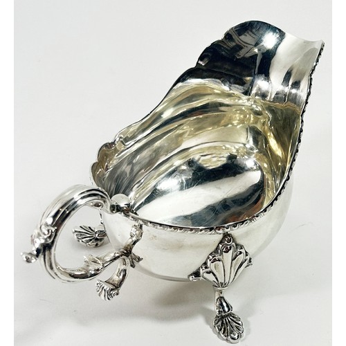 259 - A Georgian style silver gravy boat, Birmingham 1938, maker Barker Brothers Silver Ltd, 10 ozs approx... 