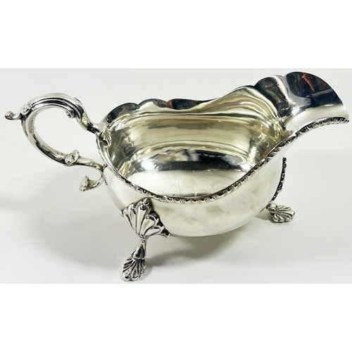 259 - A Georgian style silver gravy boat, Birmingham 1938, maker Barker Brothers Silver Ltd, 10 ozs approx... 