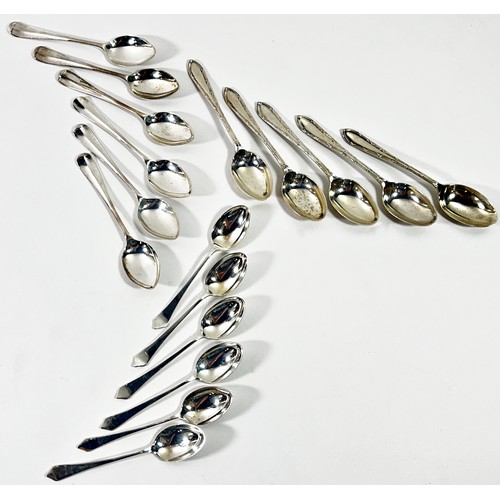 261 - Two cases with six silver teaspoons, a third case with five and a toast rack, 8.7ozs approximately