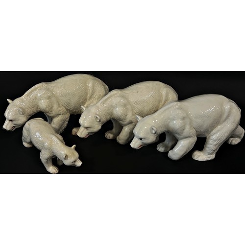 91 - Four Melba ware figures of polar bears, 43cm long and smaller (4)