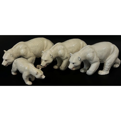 91 - Four Melba ware figures of polar bears, 43cm long and smaller (4)