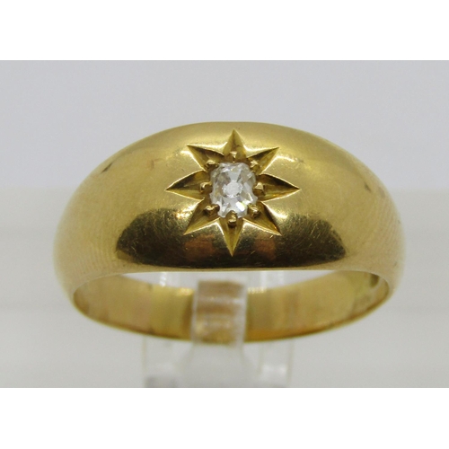 324 - Early 20th century 18ct gypsy ring set with an old-cut diamond within star-cut surround, 0.15ct appr... 