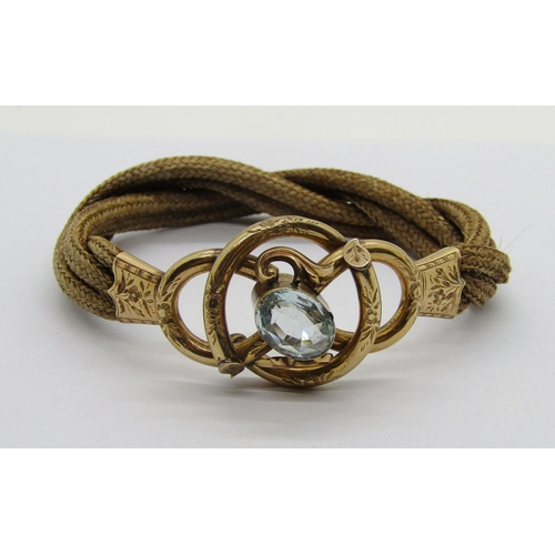 333 - 19th century yellow metal and woven hairwork mourning bracelet set with an oval pale aquamarine, wit... 