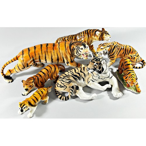 44 - A collection 13 ceramic tigers, various factories, 30cm high and smaller