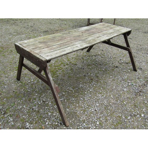 1091 - A weathered Hattersley Keighley teak garden table, the rectangular slatted top raised on splayed 'A'... 