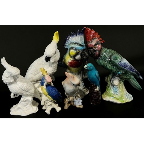 145 - A collection of ceramic cockatoos, some with high glaze lustre (7)