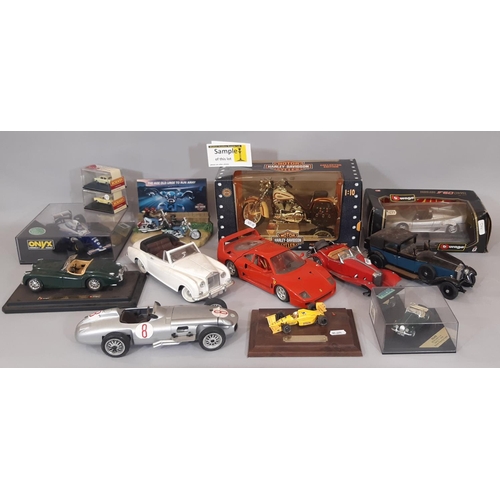 714 - A collection of model vehicles including boxed Harley- Davidson Heritage Springer, boxed Damien Hill... 