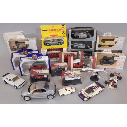 714 - A collection of model vehicles including boxed Harley- Davidson Heritage Springer, boxed Damien Hill... 