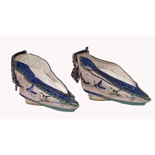 722 - A pair of early 20th century indoor lotus shoes for bound feet with embroidered silk upper and colou... 