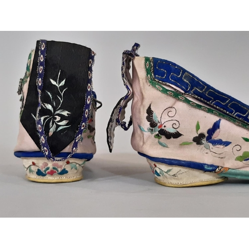 722 - A pair of early 20th century indoor lotus shoes for bound feet with embroidered silk upper and colou... 