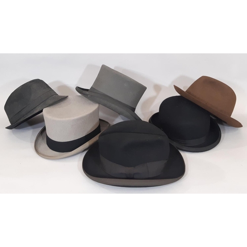 724 - Six mens' hats comprising 2 grey felt top hats, a bowler by Dunn & Co size 7⅛, a black Homburg hat b... 