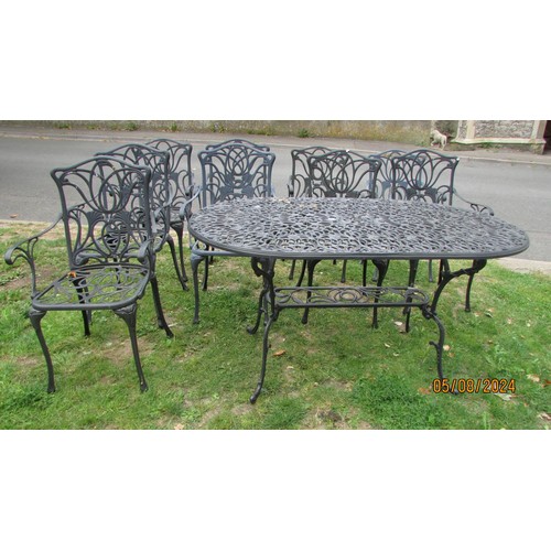 1056 - A mat painted cast aluminium garden terrace table over oval form with decorative pierced and scrolli... 