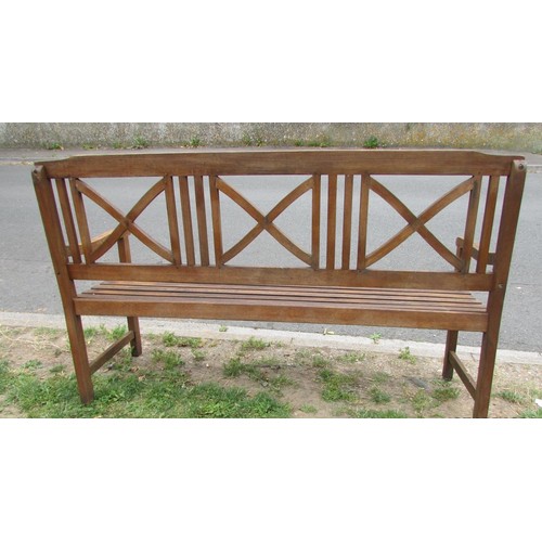 1077 - A contemporary stained hardwood three seat garden bench with slatted seat and back with open x frame... 