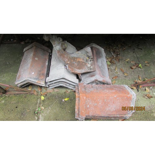 1012 - Architectural salvage - Victorian and later terracotta ridge tiles, two designs, 22 pierced castella... 