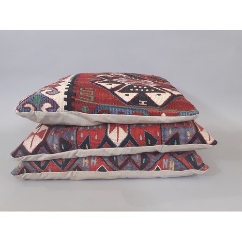 727 - Three cushions made from old kelim with zipped fabric backs. Largest are approx 45x45cm