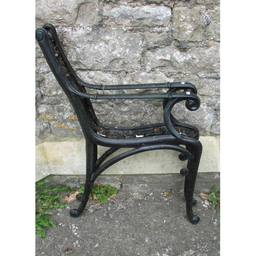 1030 - A pair of cast iron garden bench ends with scrolled arms and supports