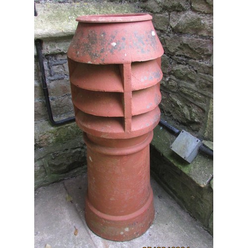 1025 - A weathered terracotta cylindrical chimney pot with vented top (af) later adapted as a planter 90 cm... 