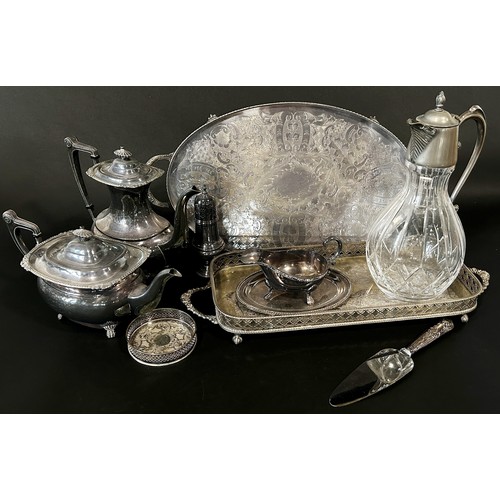 217 - A mixed selection of silver plated table ware, including candlesticks, a claret jug, a four piece te... 