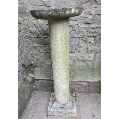 1028 - A weathered garden bird bath in three sections with cast composition stone circular top and square  ... 