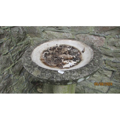 1028 - A weathered garden bird bath in three sections with cast composition stone circular top and square  ... 