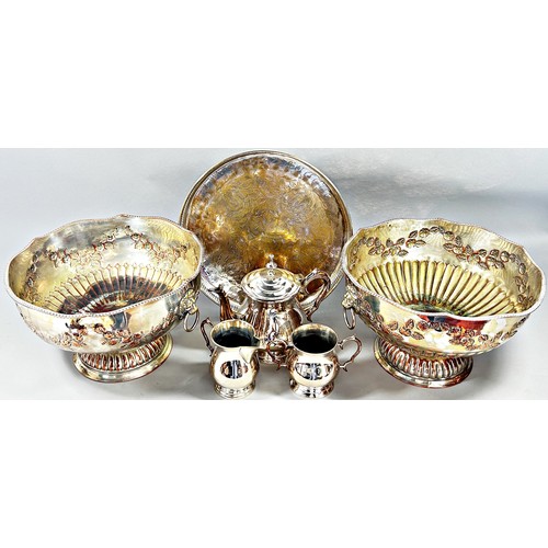 213 - A large pair of Georgian style silver plated punch bowls engraved with garlands of flowers and lion ... 