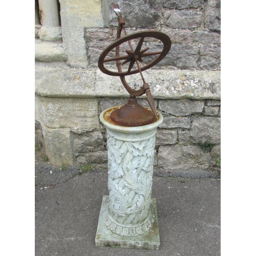 1027 - A weathered cast iron sun dial raised on a composite cylindrical square based pedestal with acanthus... 