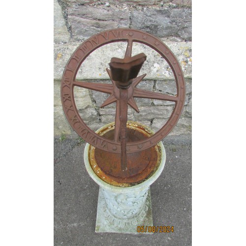 1027 - A weathered cast iron sun dial raised on a composite cylindrical square based pedestal with acanthus... 