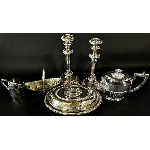 211 - A good selection of silver plated tableware including a pair of Georgian style candlesticks, tea pot... 