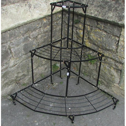 1044 - A painted light steel freestanding corner plant stand on three graduated bow fronted tiers, 73 cm hi... 