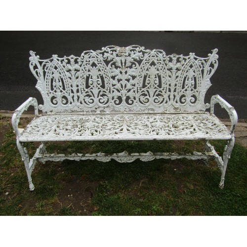 1069 - A good quality cream painted and weathered heavy gauge cast metal three seat garden bench with decor... 